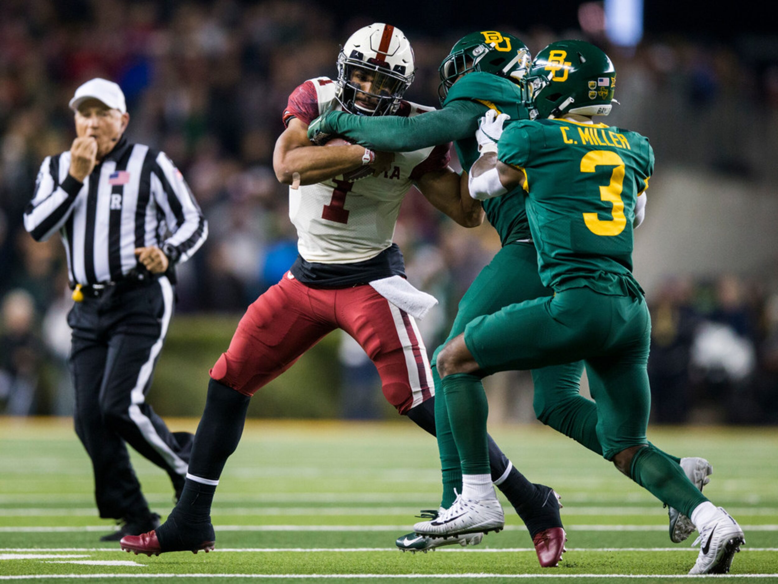 Baylor Bears cornerback Jameson Houston (11) and safety Chris Miller (3) tackle Oklahoma...