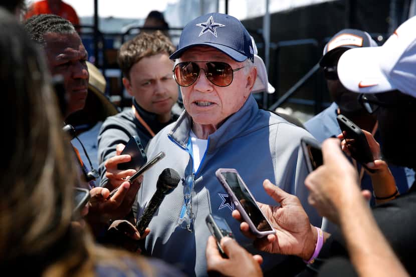 Dallas Cowboys owner Jerry Jones visits with media following training camp practice in...