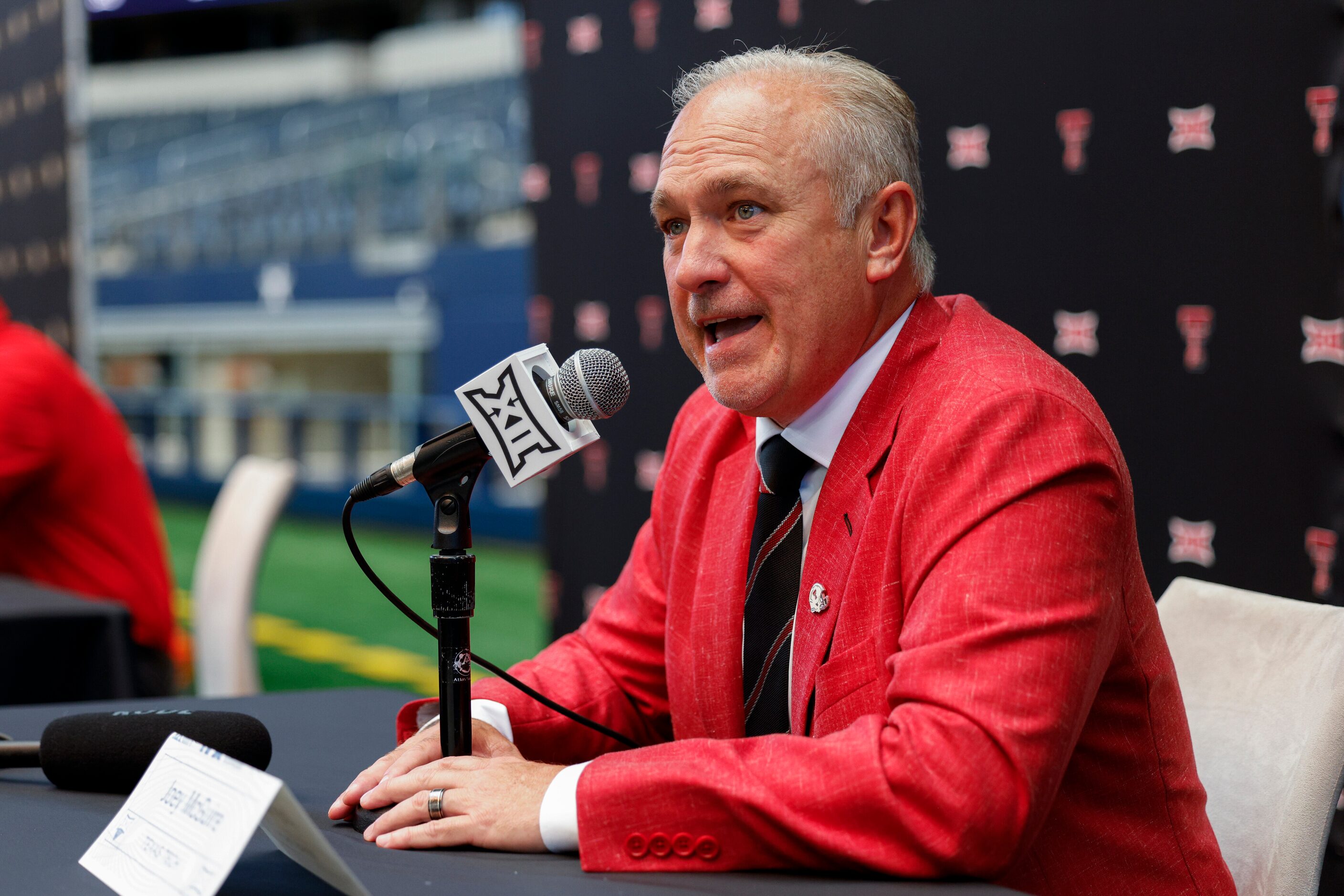 Texas Tech head coach Joey McGuire talks to reporters during the Big 12 Media Days at AT&T...