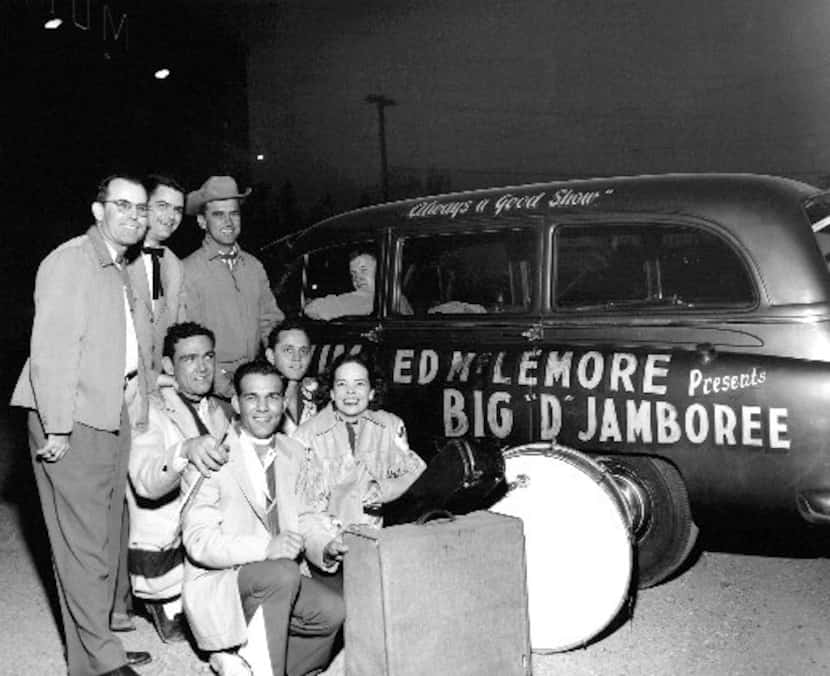 Charline Arthur (beside drum) and the Big D Jamboree crew ham it up outside the Dallas...