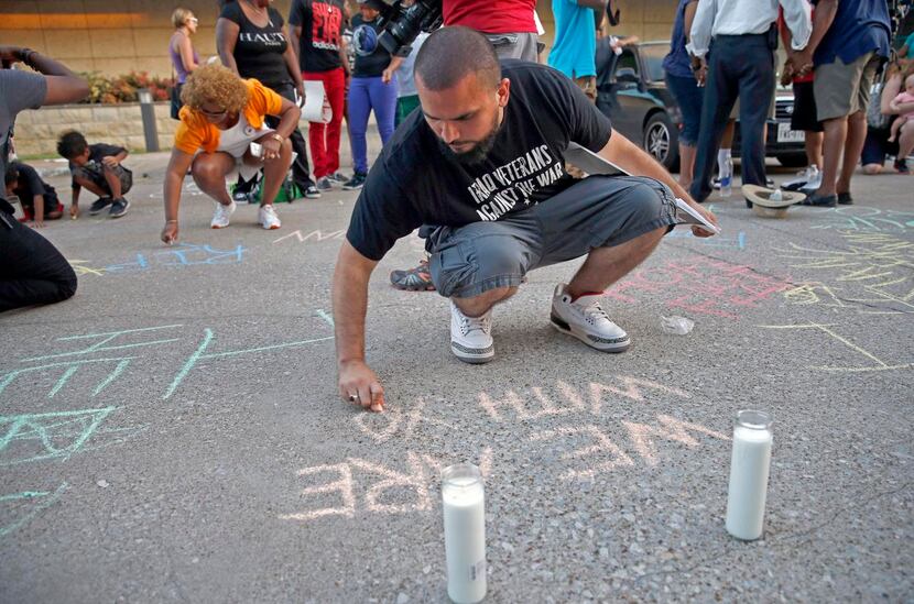 
Ramon Mejia joined other participants in a vigil Monday evening for Christian Taylor by...