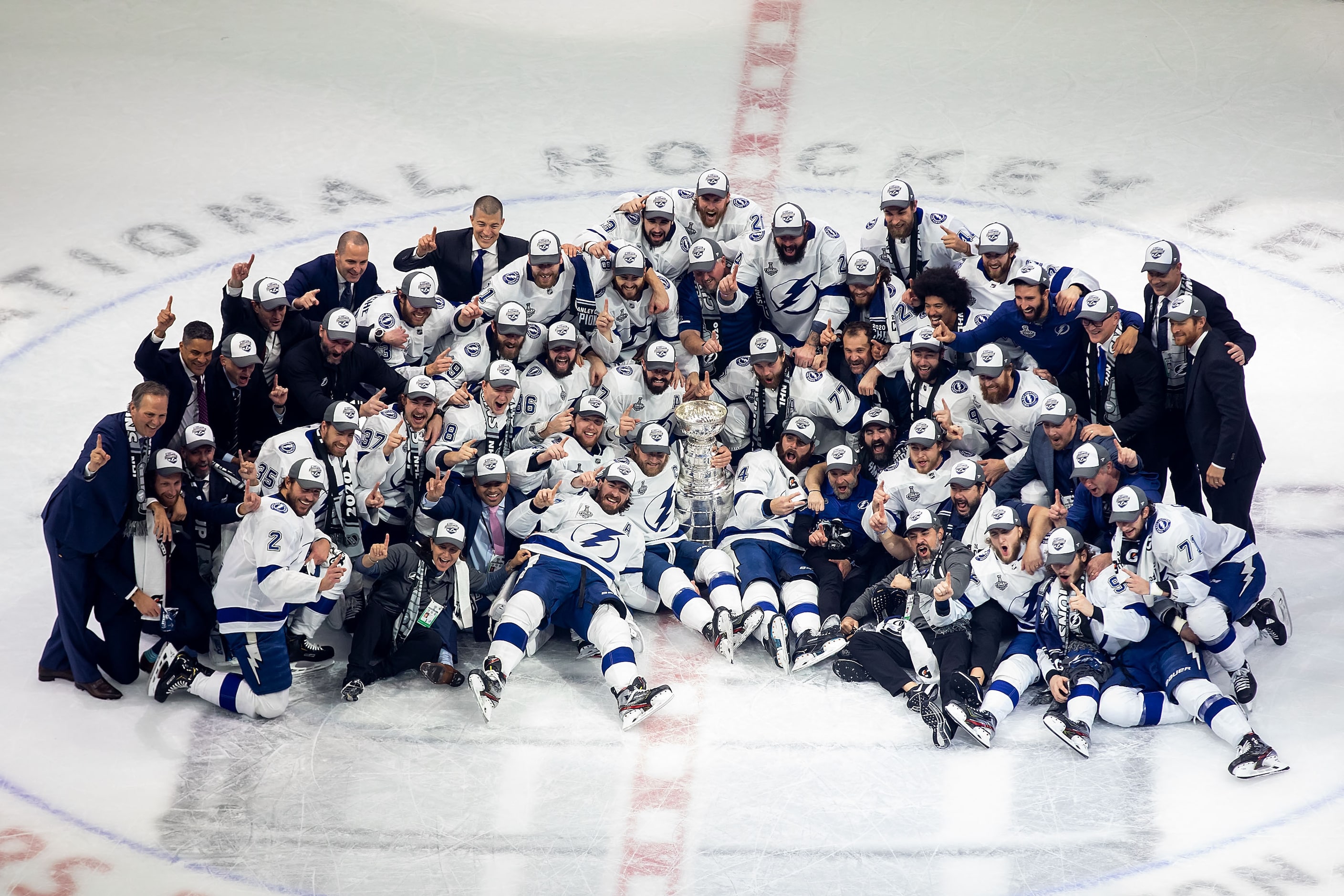 The Tampa Bay Lightning pose with the Stanley Cup after defeating the Dallas Stars during...