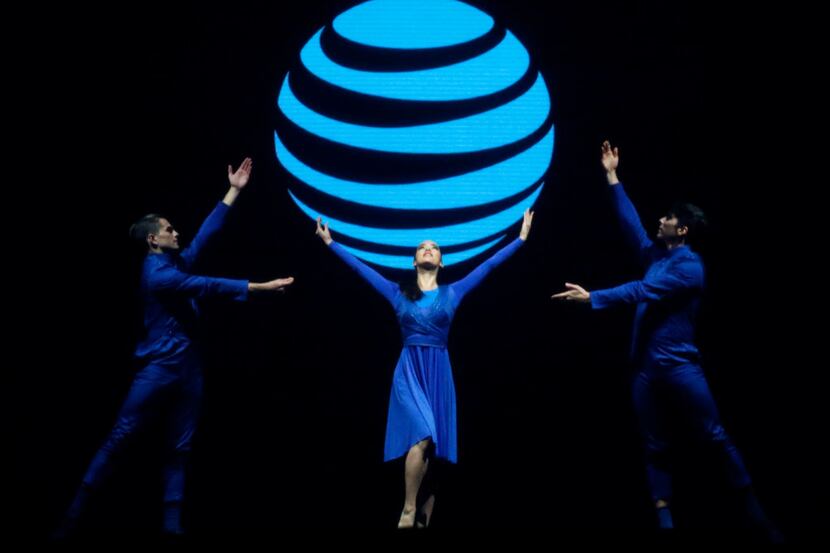 Performers dance in font of an interactive screen showing the AT&T logo at Gaylord Texan...