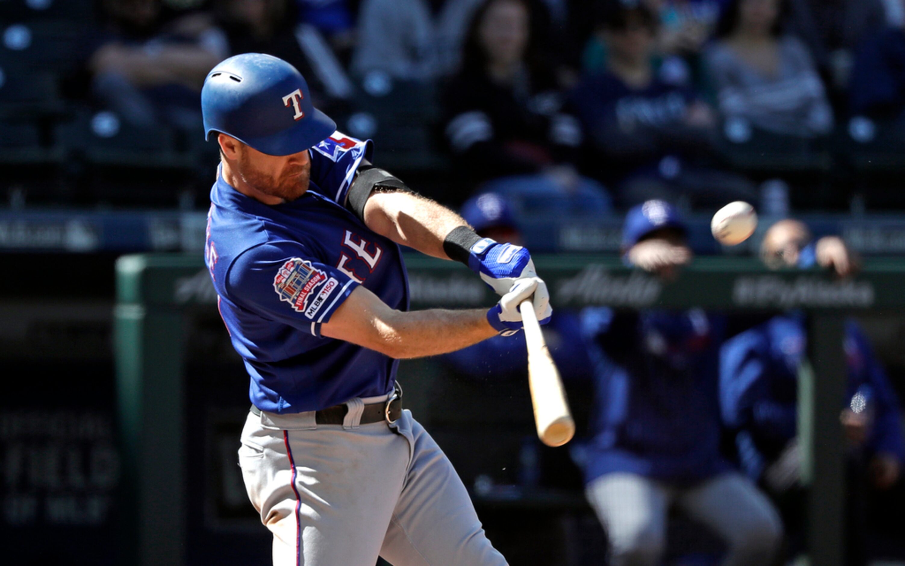 Texas Rangers' Logan Forsythe connects on a three-run home run against the Seattle Mariners...