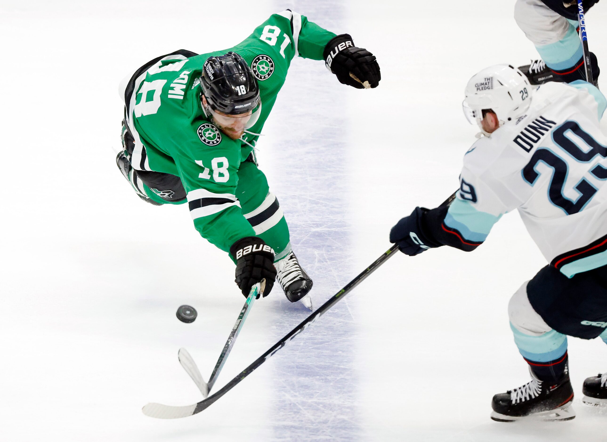 Dallas Stars center Max Domi (18) reaches for the puck during the second period against...