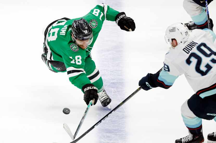 Dallas Stars center Max Domi (18) reaches for the puck during the second period against...