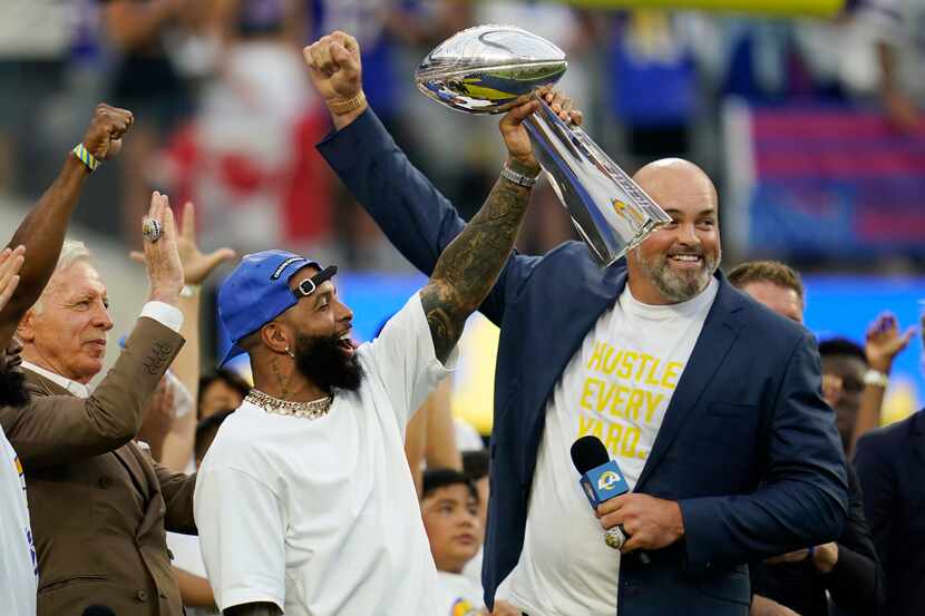 Former Los Angeles Rams wide receiver Odell Beckham Jr., center, lifts the 2021 championship...