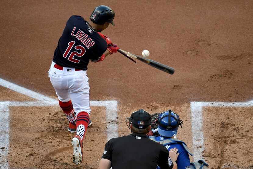 CLEVELAND, OH - OCTOBER 15:  Francisco Lindor #12 of the Cleveland Indians brakes his bat as...