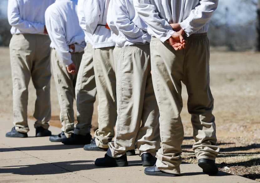 Juveniles make their way to another building to eat lunch at the Gainesville State School on...