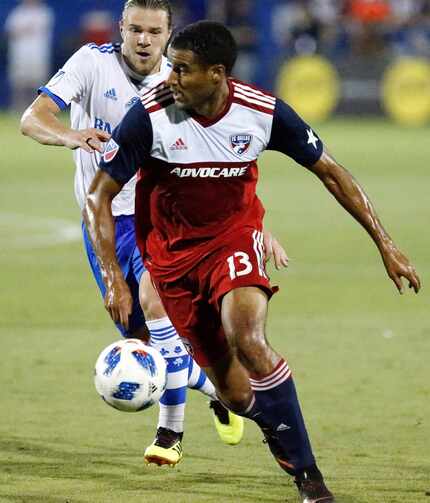 FC Dallas forward Tesho Akindele (13) controls the soccer ball in front of Montreal Impact...