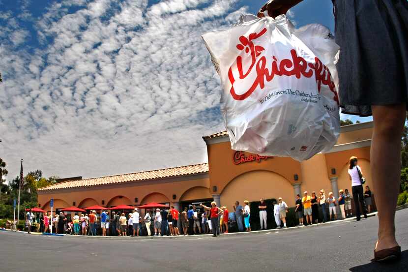 Hundreds of customers line up at the Chick-fil-A restaurant in Laguna Niguel, California on...