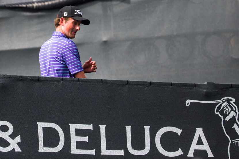 Webb Simpson walks across a bridge from the 18th green during round three of the Dean &...