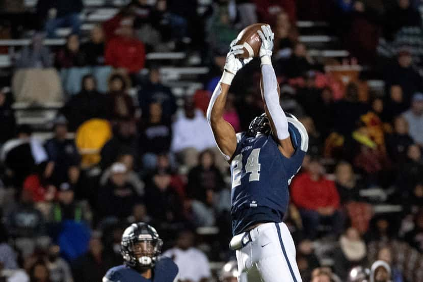 Frisco Lone Star junior linebacker Jaylan Ford (24) intercepts a pass against Mansfield...