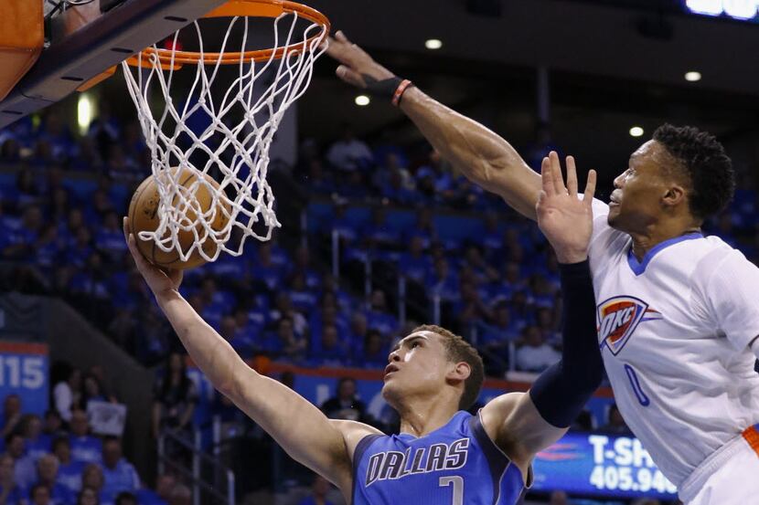 Dallas Mavericks forward Dwight Powell (7) goes up for a basket ahead of Oklahoma City...