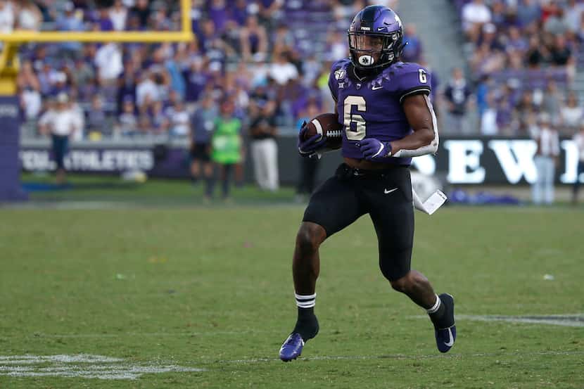 TCU running back Darius Anderson (6) runs the ball against SMU during the second half of an...