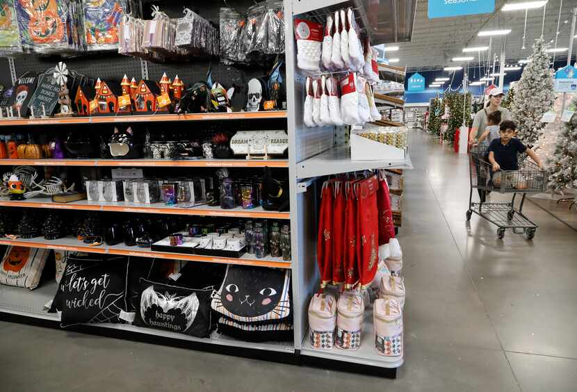Shoppers pass by the only Halloween items left at the At Home Store in Plano on Tuesday.