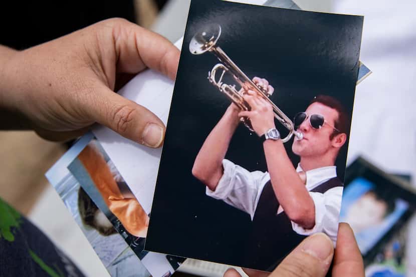 Susana Tirado holds a photo of her late son, Edgar Luis Tirado Jr., at an event raising...