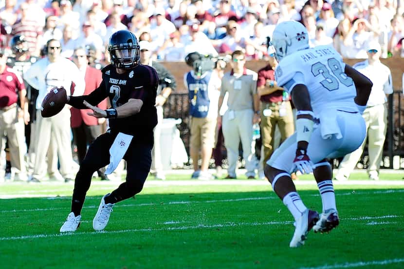 STARKVILLE, MS - NOVEMBER 03:  Johnyy Manziel #2 of the Texas A&M Aggies is pressured by ...