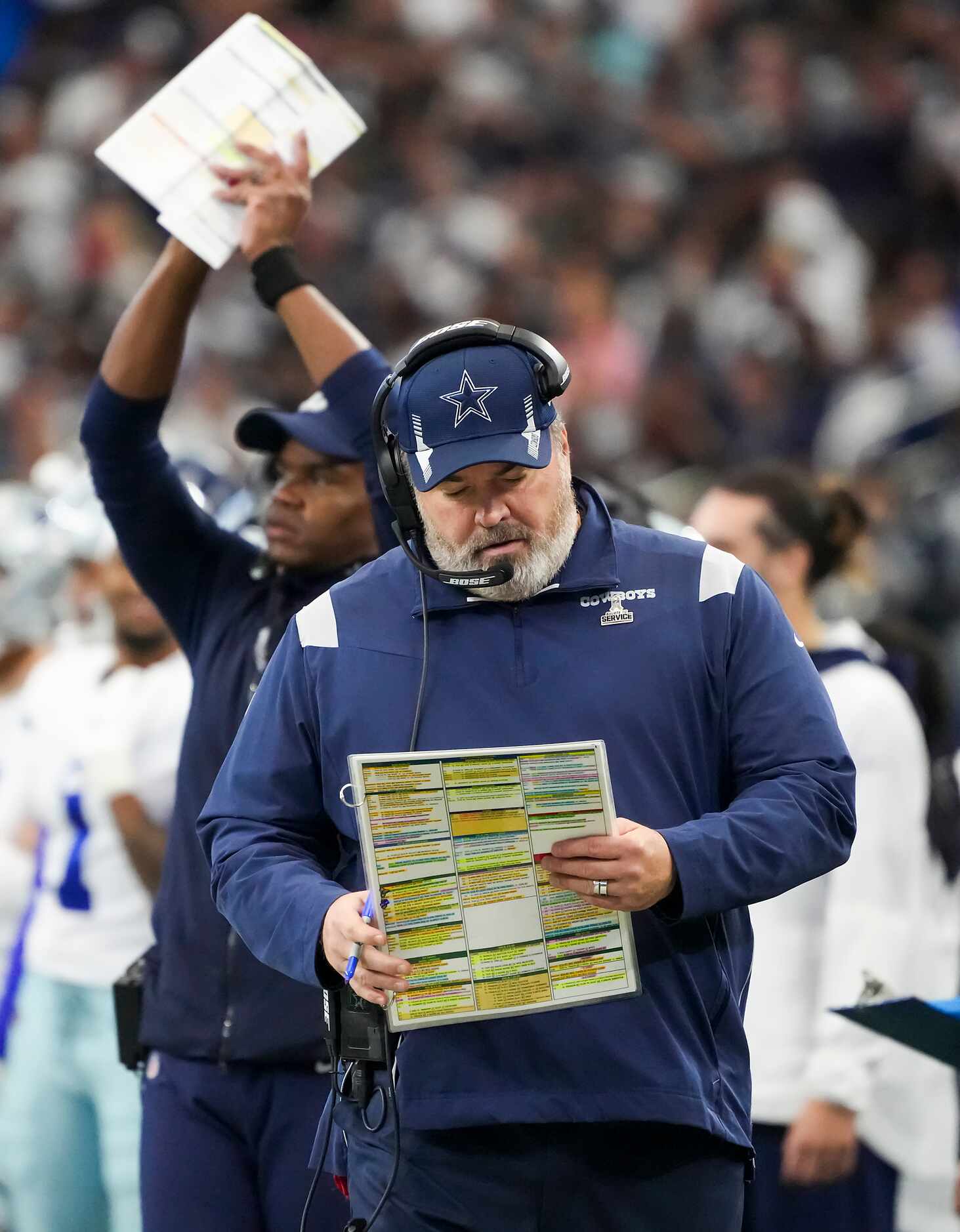 Dallas Cowboys head coach Mike McCarthy works on the sidelines during the first half of an...