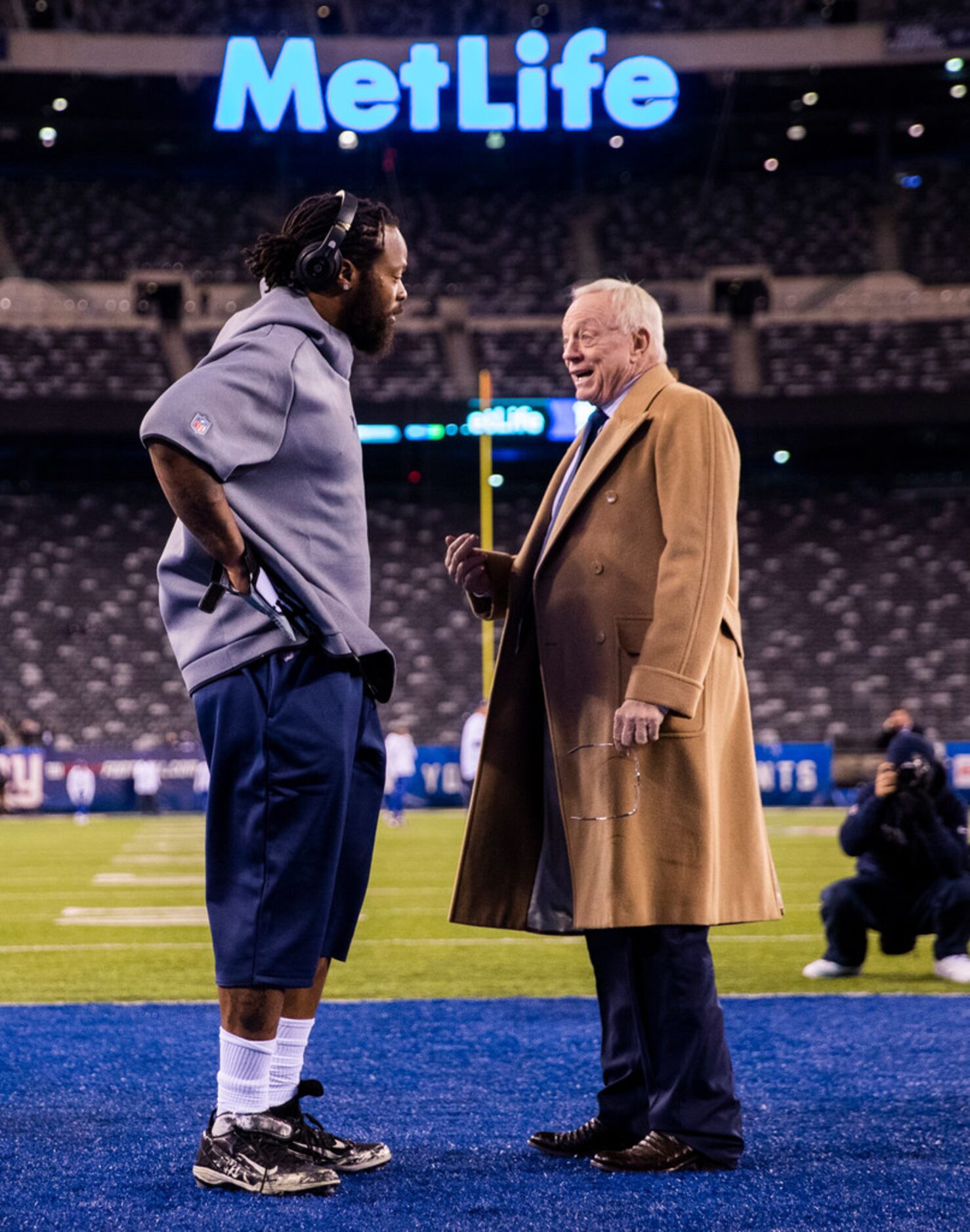 Dallas Cowboys Owner Jerry Jones talks with Dallas Cowboys defensive end Michael Bennett...