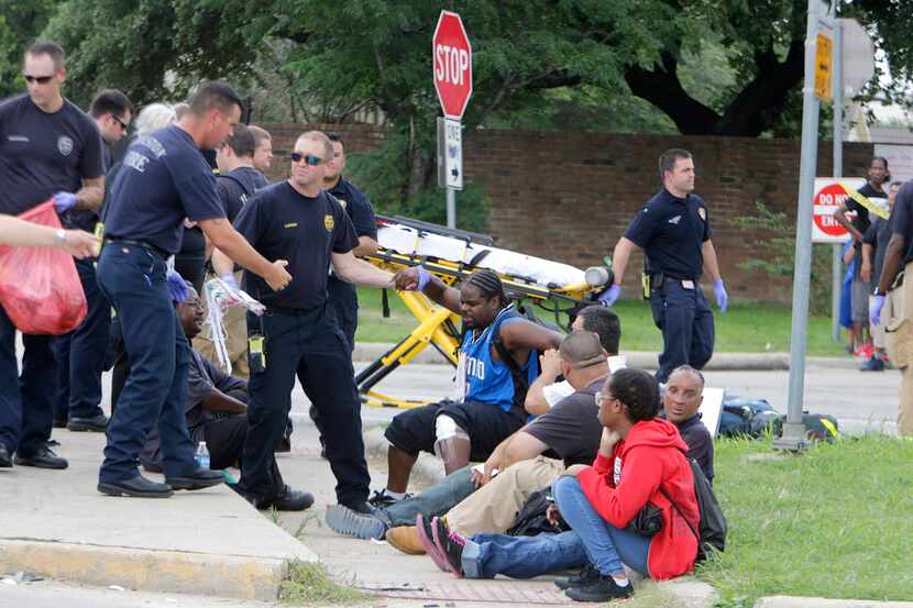  Firefighters assess passengers from the bus. (Mark Mulligan/Houston Chronicle)