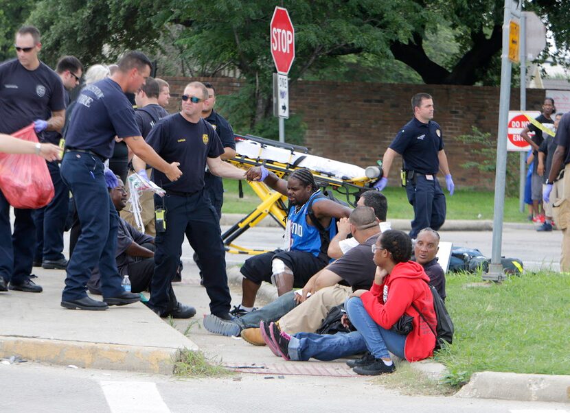  Firefighters assess passengers from the bus. (Mark Mulligan/Houston Chronicle)