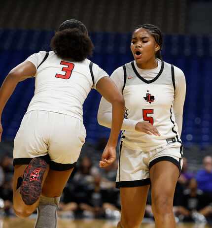 Frisco Liberty's Keyera Roseby (5) congratulates Jacy Abii (3) after a basket in a girls...