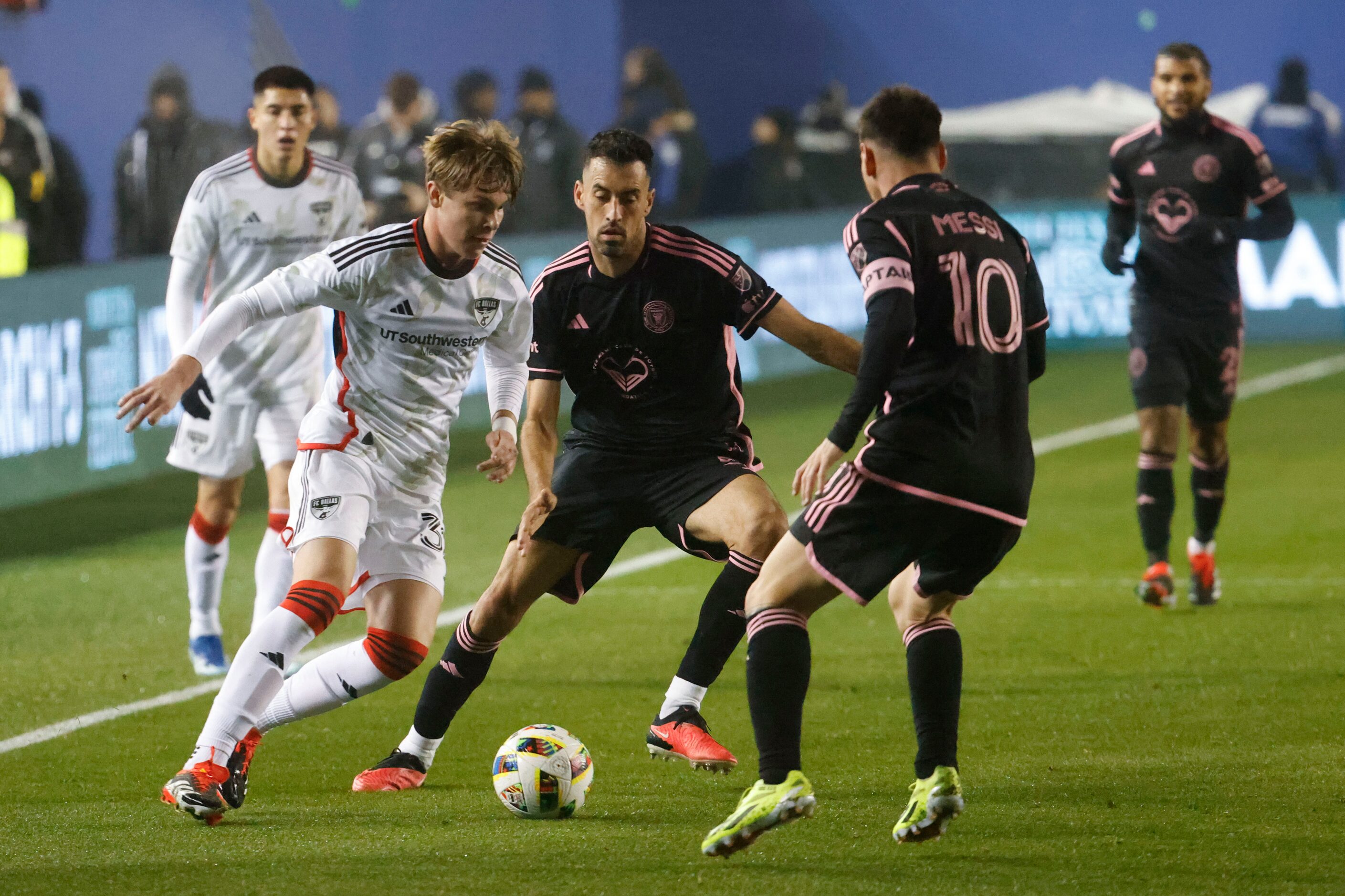 FC Dallas defender Nolan Norris (left) dribbles through Inter Miami midfielder Sergio...