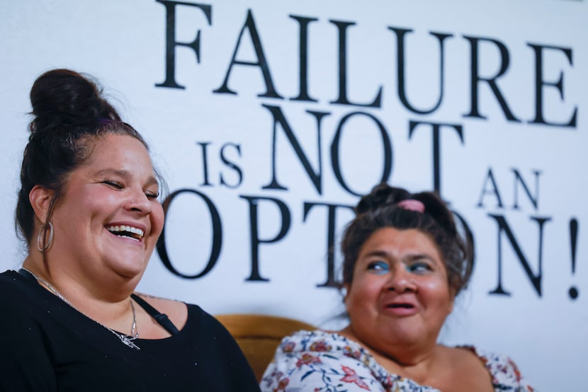 Navarro (left) shares a laugh with Good Girls Agency member Connie Stum in September 2023....