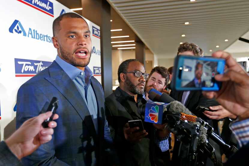 Dallas Cowboys quarterback Dak Prescott talks with the media at the Alberstons all-star gala...