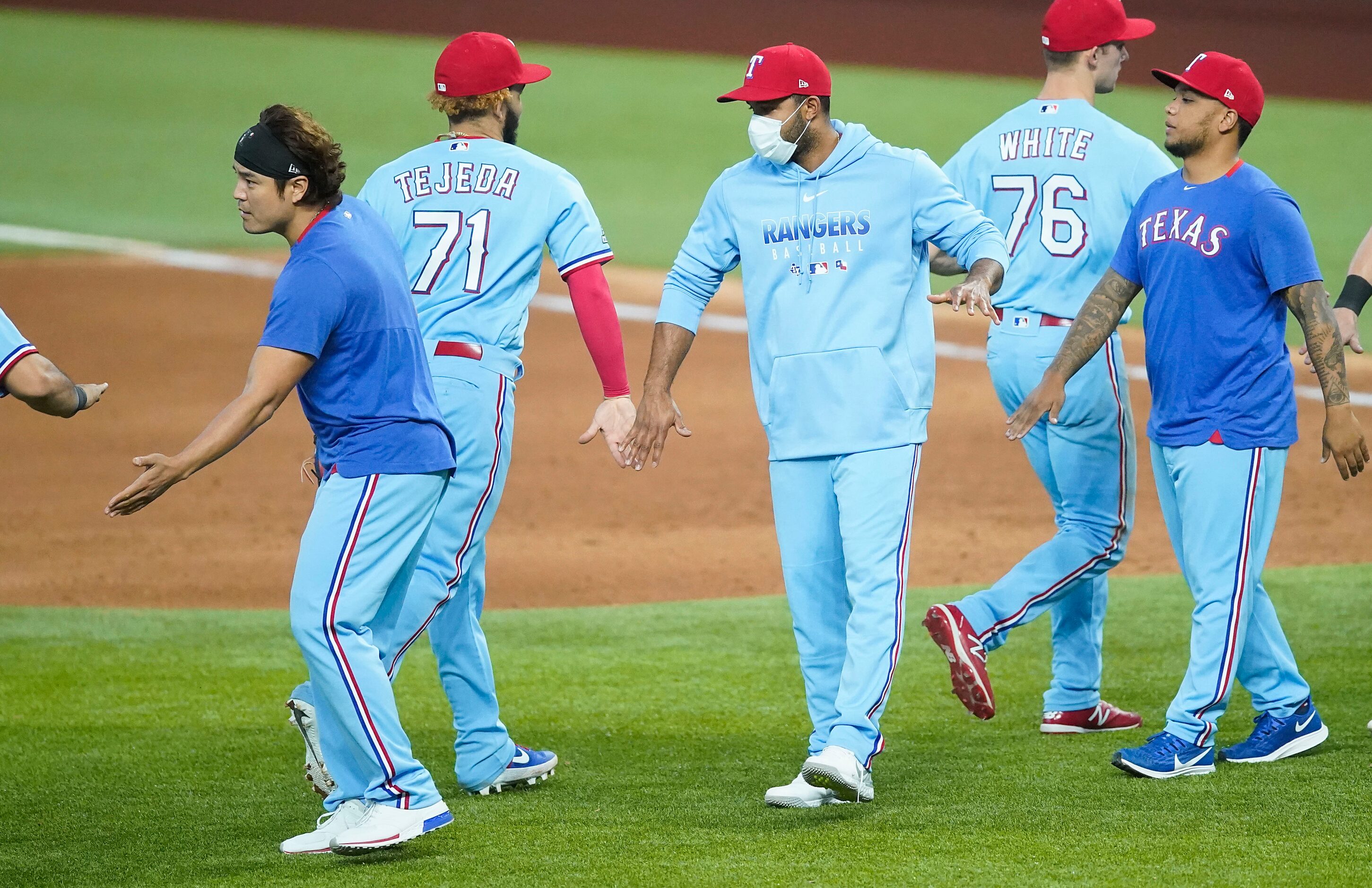 Injured Texas Rangers players, from left, Shin-Soo Choo, Elvis Andrus and Willie Calhoun...