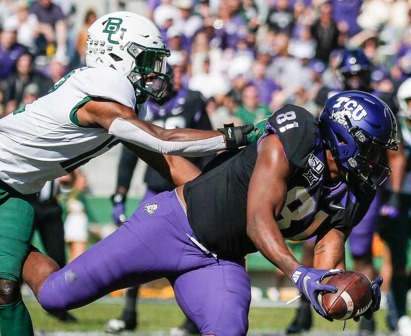 TCU Horned Frogs tight end Pro Wells (81) receives a pass as Baylor Bears cornerback Kalon...