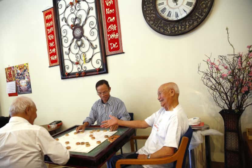 Playing Chinese chess is a chance to relax for (from left) Chuc Dao, Bryant Wilson and Thoi...