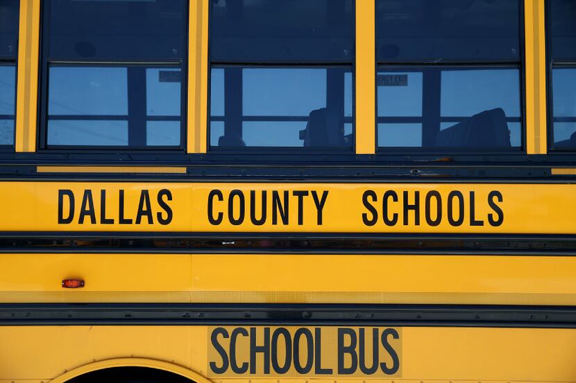 A school bus sits in the parking lot at the Dallas County Schools headquarters in Dallas. 