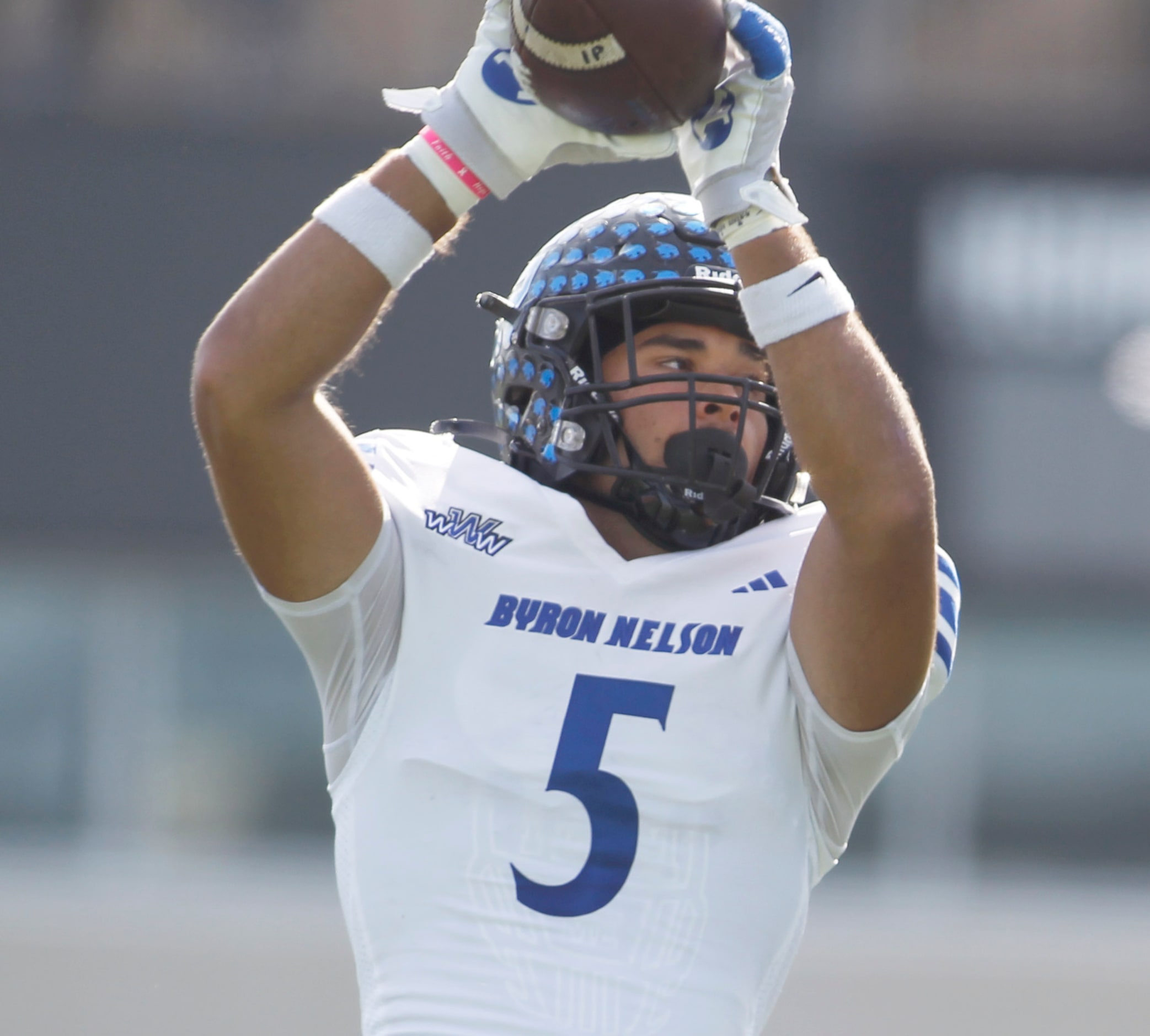 Byron Nelson's Parker Almanza (5) pulls in a reception during second half action against...