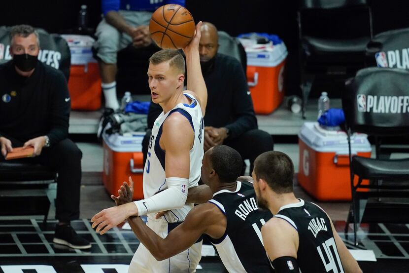 Dallas Mavericks center Kristaps Porzingis (6) works against LA Clippers guard Rajon Rondo...