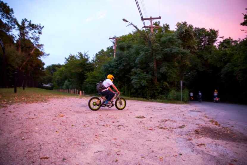 
Kyle Salter, owner of Kyle's Scooter Shop in Dallas, Texas, races to catch up with the rest...