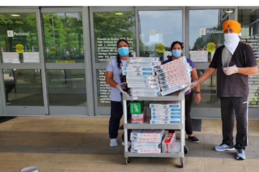 The Eknoor Gurdwara Sikh temple delivered pizzas to health care workers at Parkland Hospital...