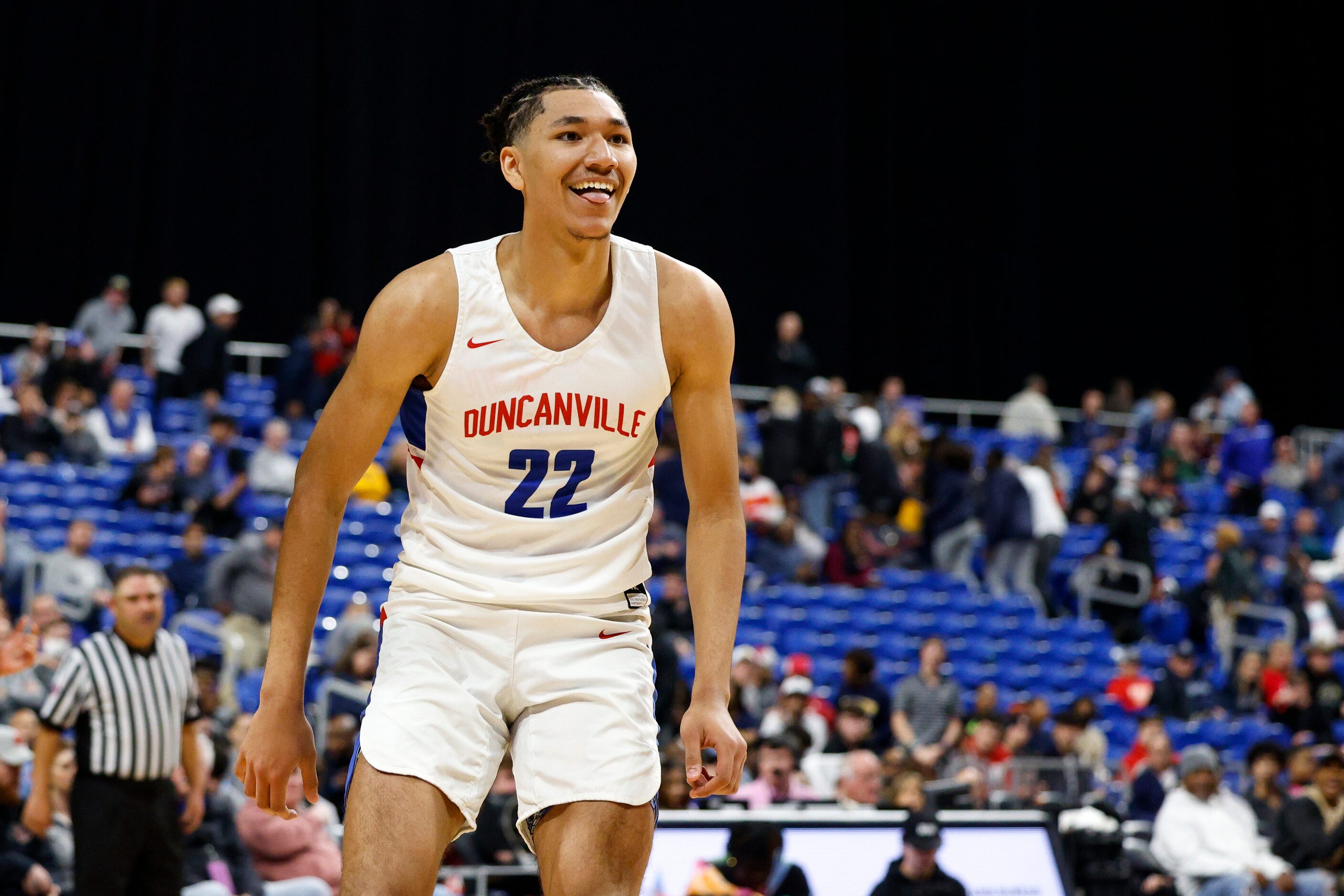 Duncanville forward Davion Sykes (22) smiles towards the Duncanville bench after a dunk...