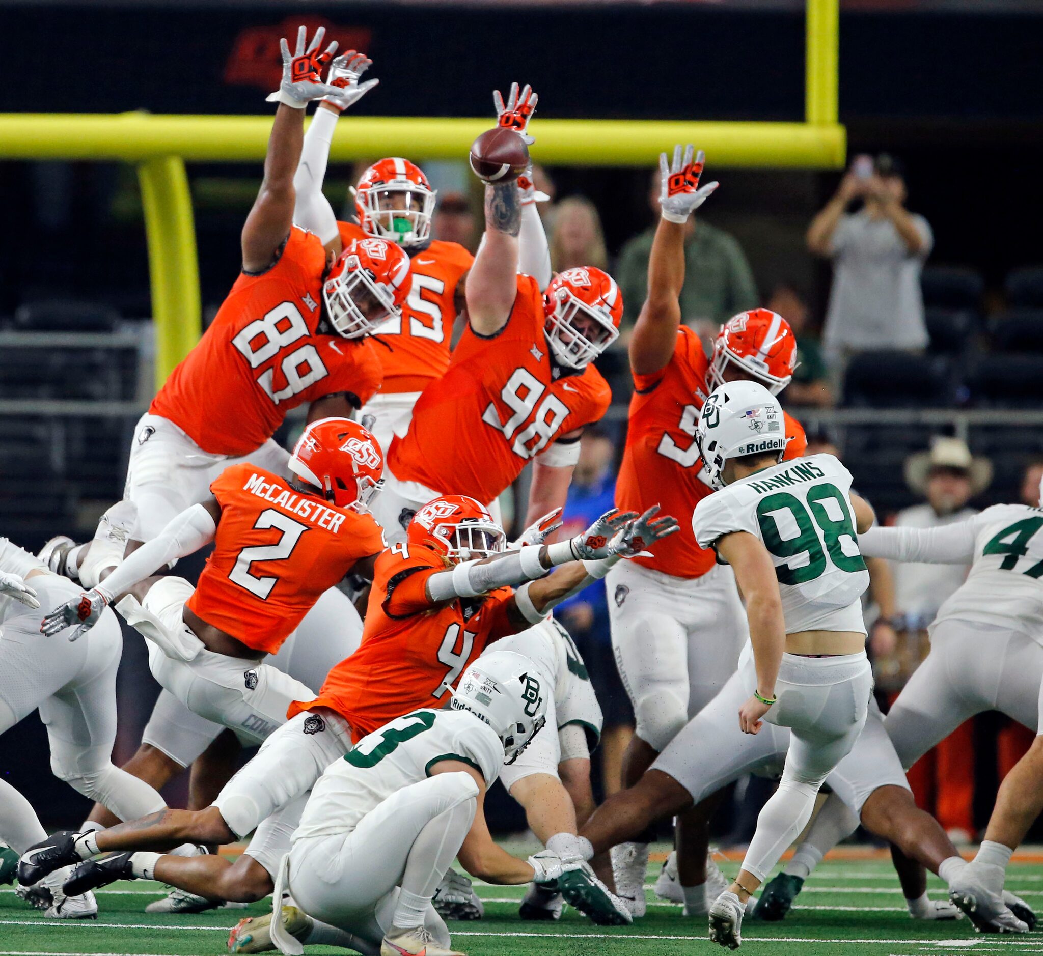 Baylor Bears place kicker Isaiah Hankins (98) misses a field goal, as he is pressured by the...