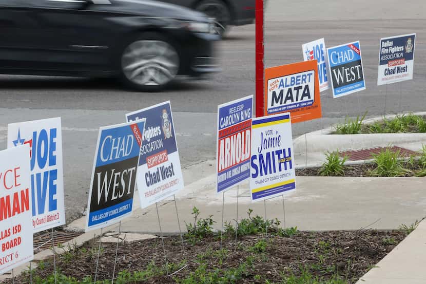 Candidate signs line the edge of the Oak Cliff Government Center in Dallas on the first day...