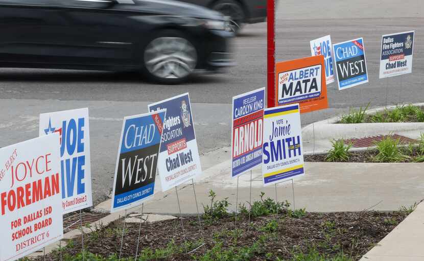 Candidate signs lined the edge of the Oak Cliff Government Center on the first day of early...