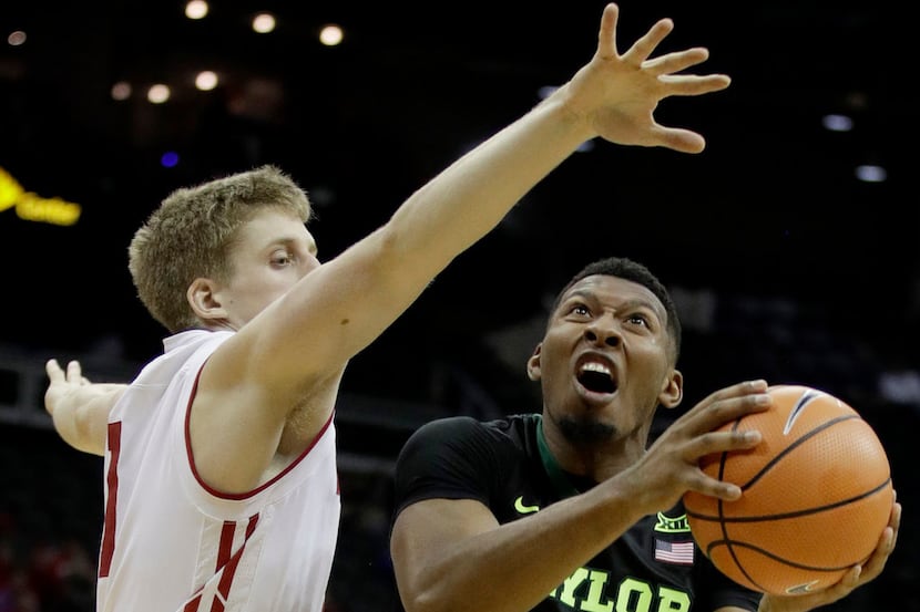Baylor's King McClure (22) shoots under pressure from Wisconsin's Brevin Pritzl during the...