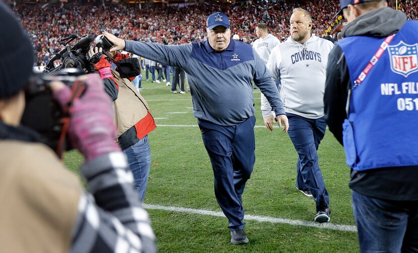 Dallas Cowboys head coach Mike McCarthy shoves KXAS (Dallas) photojournalist Noah Bullard as...