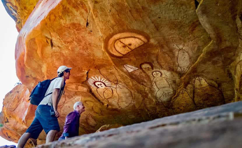 Guests hike to caves painted with thousand-year-old Aboriginal art.