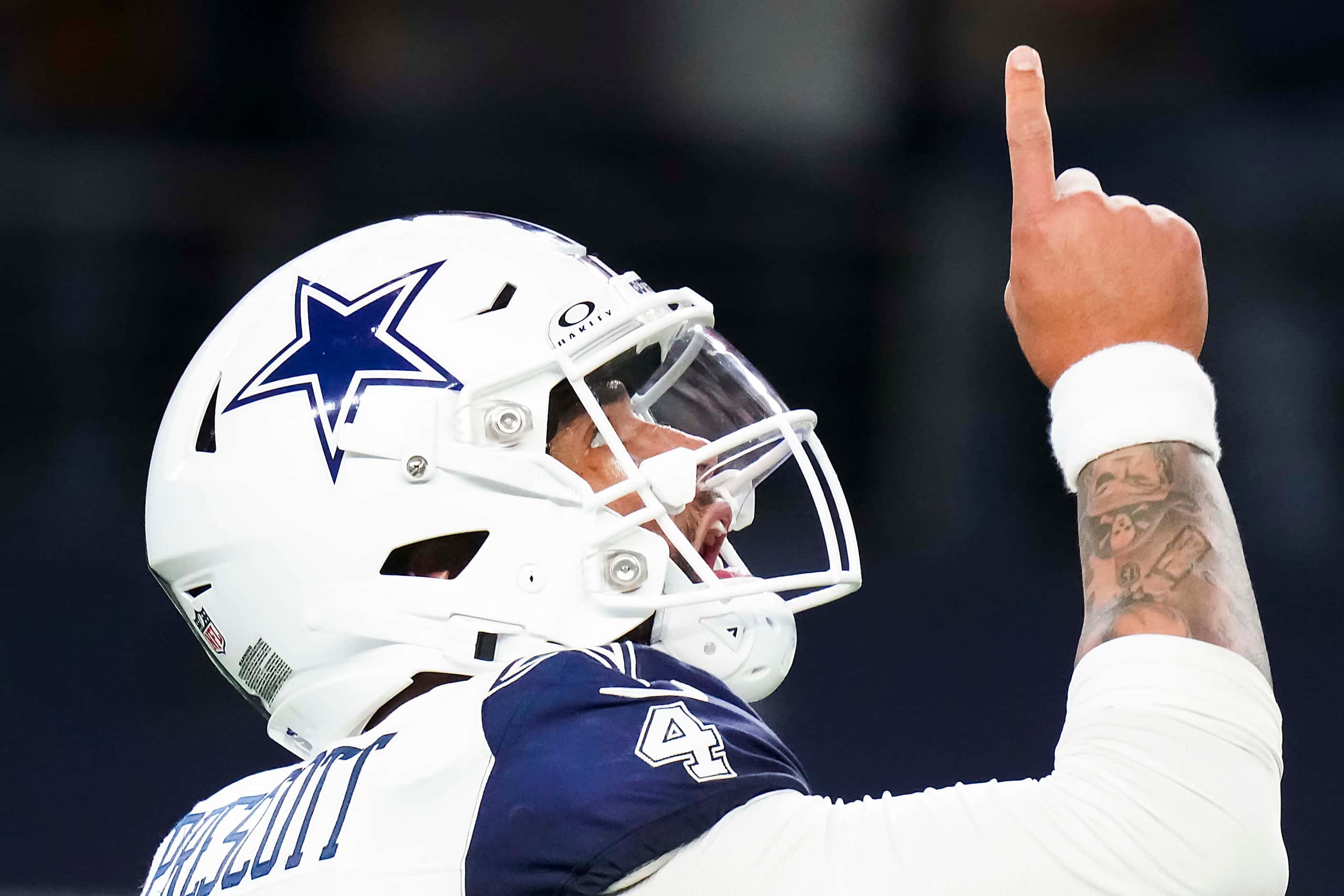 Dallas Cowboys quarterback Dak Prescott celebrates after throwing a touchdown  pass to wide...