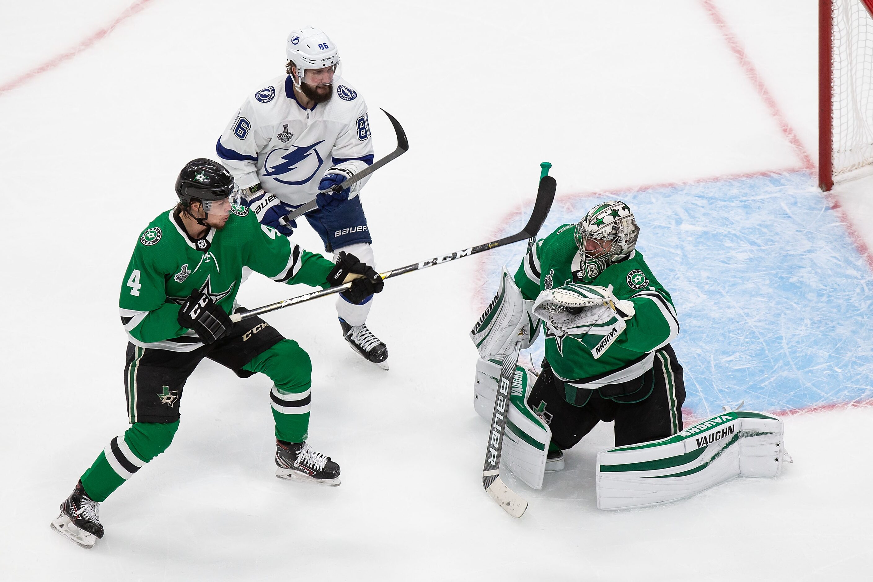 Miro Heiskanen (4) and goaltender Anton Khudobin (35) of the Dallas Stars defend against...