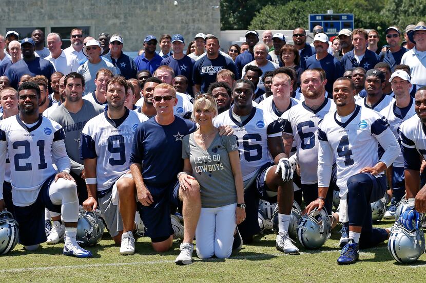 Head coach Jason Garrett and his wife Brill Garrett pose front and center with Dallas...