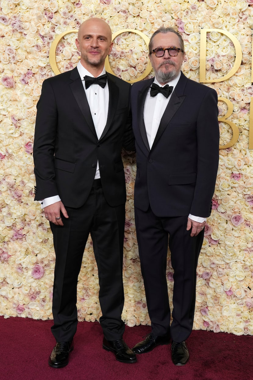 Adam Randall, left, andGary Oldman arrive at the 82nd Golden Globes on Sunday, Jan. 5, 2025,...