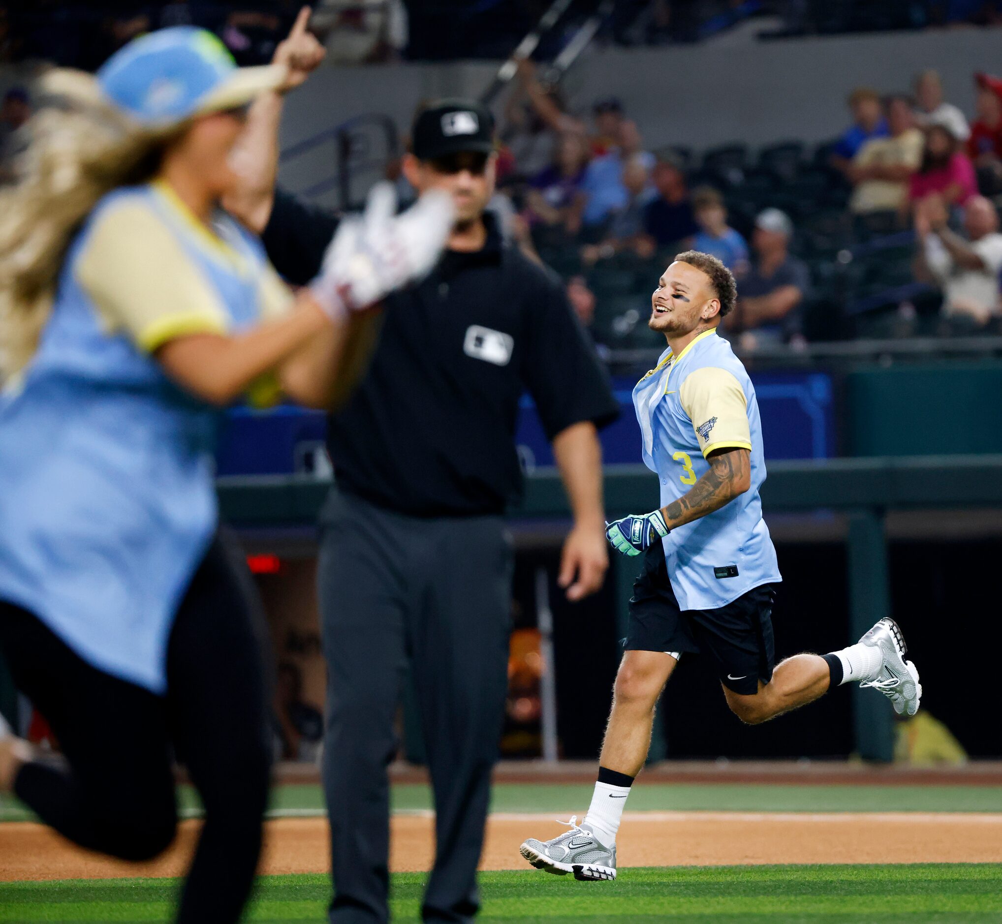 Country singer Kane Brown (right) circles the bases after hitting an RBI homer for the...